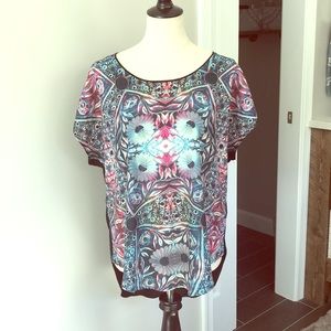 Cool mixed media hi-lo top